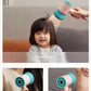 Parent using Babycare baby hair dryer to gently blow-dry a child’s hair and cool under armpits, featuring low noise and even airflow for comfort