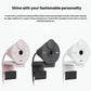 Row of three Logitech Brio 300 webcams in rose, graphite, and off-white finishes, each with the privacy cover closed.