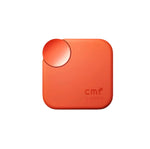 Front view of the orange CMF Buds 2a charging case featuring a sleek matte finish, signature rotating control knob, and "cmf by NOTHING" branding in subtle dot matrix style.