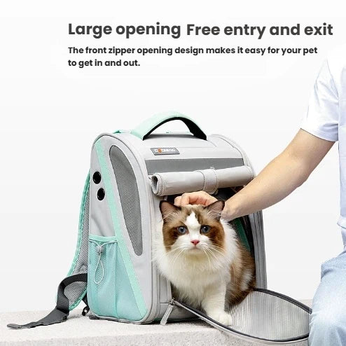 Person gently helping a cat enter Dogness expandable pet carrier through front zipper opening – wide entry allows pets to get in and out comfortably