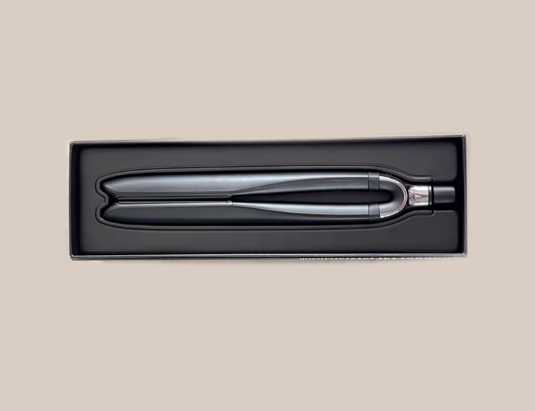Complete Dyson Airwrap 2X multistyler set displayed with all attachments: conical roll, smoothing nozzle, pre-shaped nozzle, large round brush, and storage case. Premium design for versatile styling.