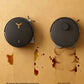 A top-down comparison showing the ECOVACS Deebot X8 Pro Omni's OZMOROLLER completely removing a stubborn coffee stain, while a conventional robot mop smears the dirt. This demonstrates its superior cleaning pressure.
