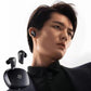 Man wearing Edifier S10 true wireless earbuds with active noise cancellation, highlighting stylish black design and secure fit for all-day comfort.