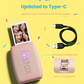 Fujifilm Instax Mini Link 3 in rose pink printing a photo with four selfie shots. Features updated USB-C charging port and dedicated charging cable for faster, safer charging. Ideal for portable instant printing.