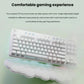 Lifestyle image of the white G715 keyboard on a mint-green surface, illustrating the compact 87-key layout, two-stage adjustable feet, and plush cloud wrist rest for all-day comfort.