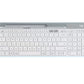 Clean overhead view of the off-white Logitech K580 wireless keyboard, highlighting its ultra-thin profile, integrated device slot, and quiet low-profile keys.