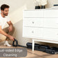 A man easily cleans right up to the baseboards using the Tineco FLOOR ONE S7 Stretch, demonstrating its effective dual-sided edge cleaning feature for a complete clean in any room.
