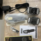 Contents of the Wahl Hair Clipper box laid out, including the clipper, combs, charger, and cleaning brush.