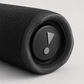 Close-up of the JBL Flip 6 passive bass radiator end cap in black