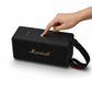 Finger pressing a control button on the Marshall Middleton II